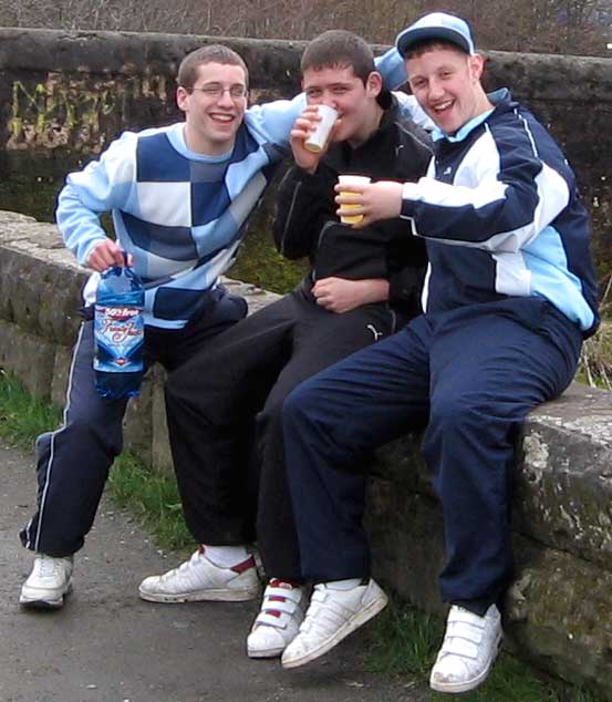 Three male youths drinking in Glasgow